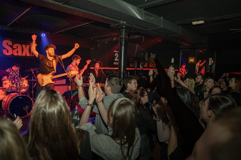 Retrodukcija and the crowd at Sax! club with their hands in the air