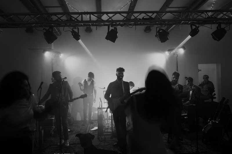 Retrodukcija playing at an urban wedding while guests dance